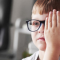 A child taking a Binocular Vision Dysfunction test - Binocular Vision Dysfunction Questionnaire