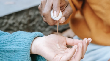 Applying hand sanitizer