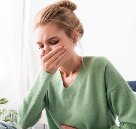 Woman suffering from nausea.